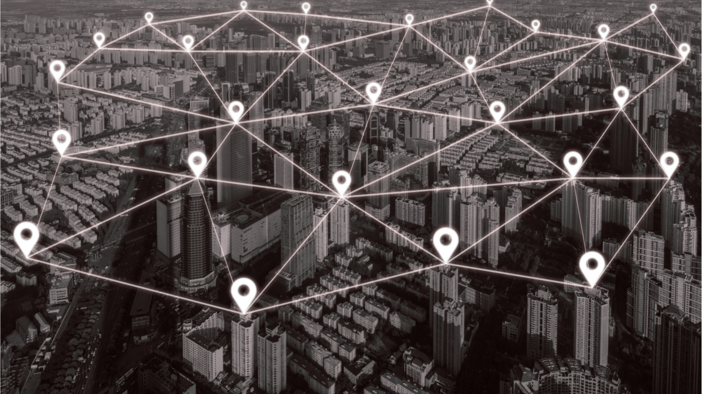 "Visão de rede de conexões e soluções 360 graus da Hub Soluções & Network sobre uma paisagem urbana."